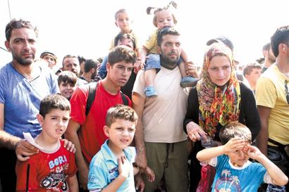 默克尔:难民危机威胁申根区存在